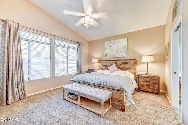 carpeted bedroom with ceiling fan and lofted ceiling