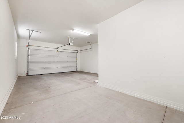 20473 W Legend Trl, Buckeye, AZ 85396 - garage featuring baseboards and a garage door opener