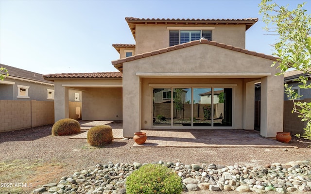 20473 W Legend Trl, Buckeye, AZ 85396 - back of property featuring a patio, stucco siding, and a tiled roof