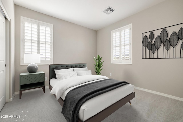 20473 W Legend Trl, Buckeye, AZ 85396 - bedroom with light colored carpet, multiple windows, and baseboards