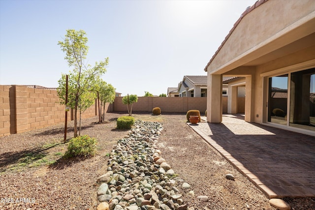 20473 W Legend Trl, Buckeye, AZ 85396 - fenced backyard with a patio area