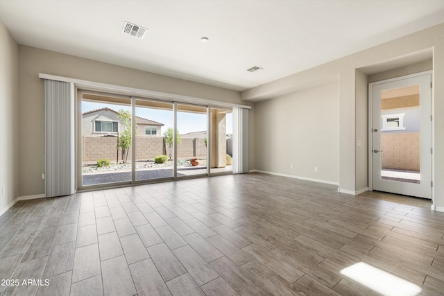 20473 W Legend Trl, Buckeye, AZ 85396 - spare room featuring wood finished floors and baseboards
