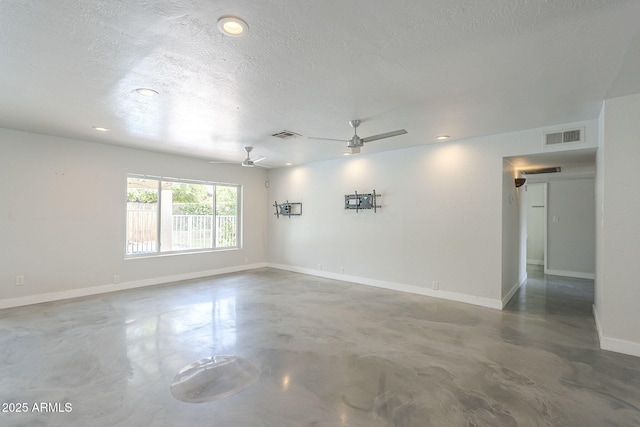 5330 E Tierra Buena Ln, Scottsdale, AZ 85254 - empty room with a ceiling fan, finished concrete flooring, baseboards, a textured ceiling, and recessed lighting