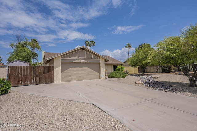 5330 E Tierra Buena Ln, Scottsdale, AZ 85254 - view of front of house with driveway, a garage, stucco siding, and fence