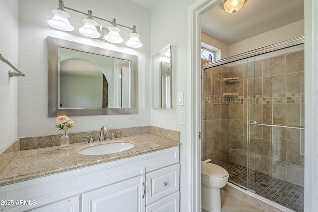 5330 E Tierra Buena Ln, Scottsdale, AZ 85254 - full bath with toilet, a stall shower, vanity, and tile patterned flooring