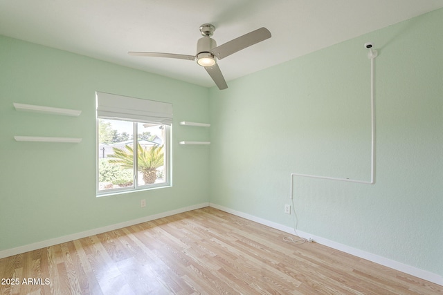 5330 E Tierra Buena Ln, Scottsdale, AZ 85254 - empty room with wood finished floors, a ceiling fan, and baseboards