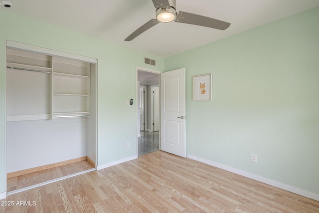 5330 E Tierra Buena Ln, Scottsdale, AZ 85254 - unfurnished bedroom featuring wood finished floors, a closet, baseboards, and ceiling fan