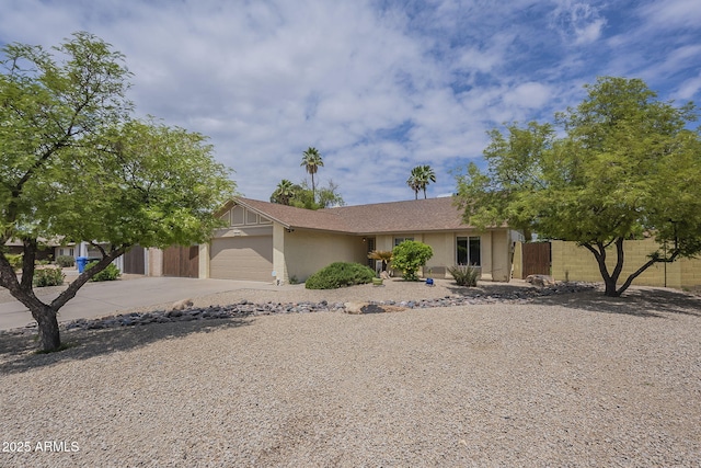 5330 E Tierra Buena Ln, Scottsdale, AZ 85254 - view of front of home featuring fence, a garage, driveway, and stucco siding