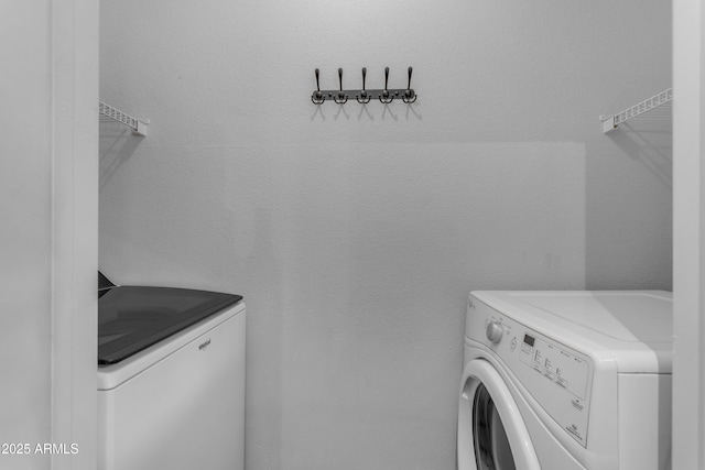 laundry room with washer and dryer