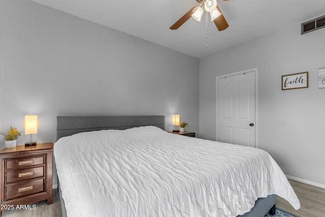 bedroom featuring ceiling fan and light hardwood / wood-style flooring