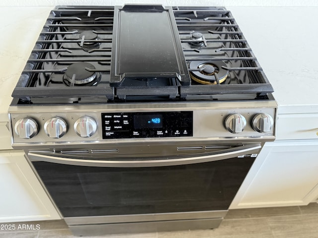 details featuring stainless steel range with gas cooktop