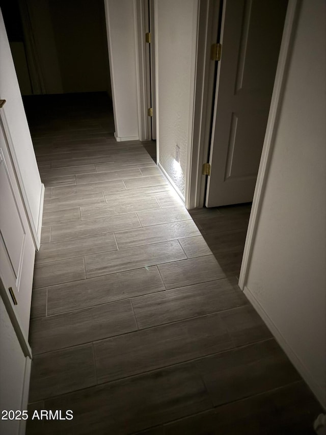 corridor featuring wood finish floors