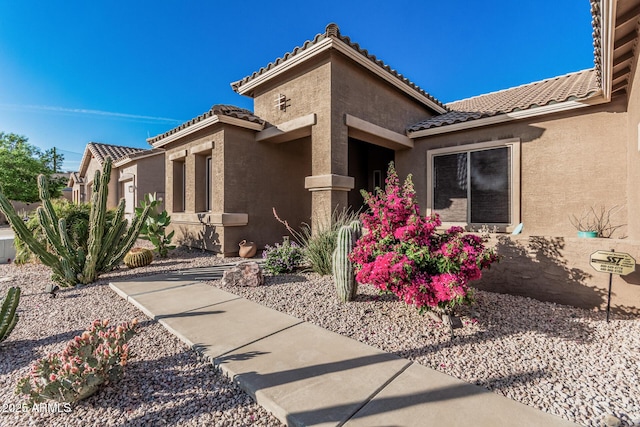 582 W Stirrup Ln, San Tan Valley, AZ 85143 - exterior space with stucco siding and a tiled roof