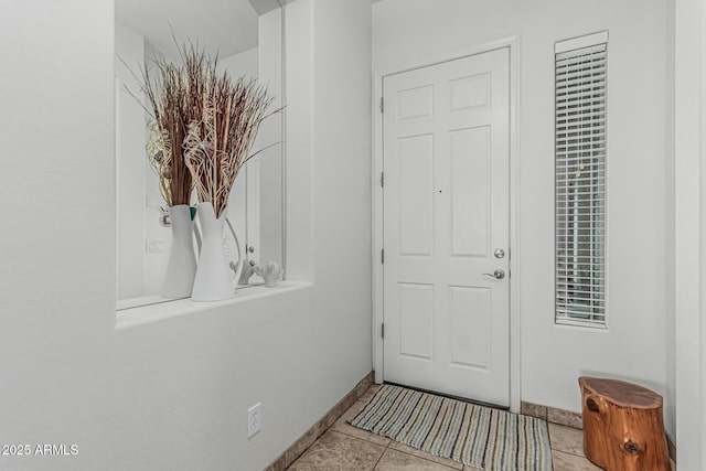 582 W Stirrup Ln, San Tan Valley, AZ 85143 - doorway with baseboards and light tile patterned floors