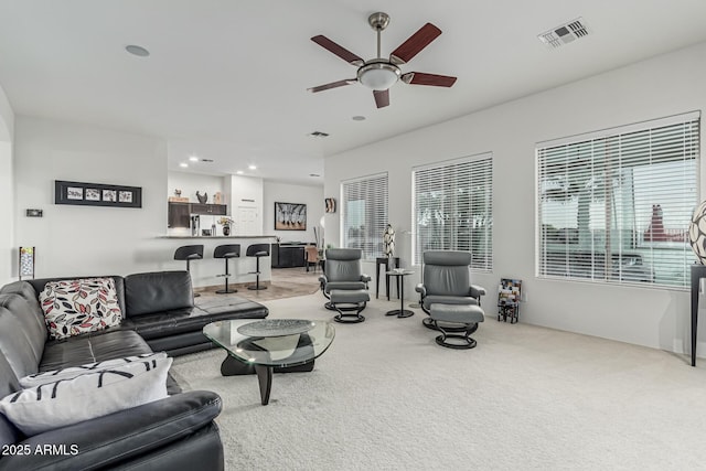 582 W Stirrup Ln, San Tan Valley, AZ 85143 - living area with ceiling fan, carpet floors, visible vents, and a wealth of natural light