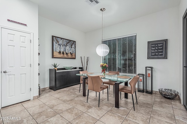 582 W Stirrup Ln, San Tan Valley, AZ 85143 - dining room with visible vents, baseboards, and light tile patterned floors