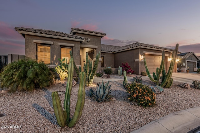 582 W Stirrup Ln, San Tan Valley, AZ 85143 - mediterranean / spanish house featuring stucco siding, a tile roof, fence, and a garage