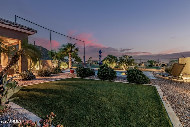 582 W Stirrup Ln, San Tan Valley, AZ 85143 - yard at dusk with fence