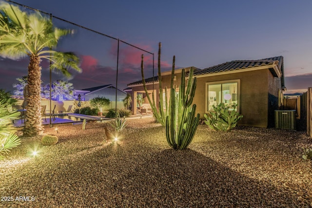 582 W Stirrup Ln, San Tan Valley, AZ 85143 - exterior space featuring stucco siding, a patio, central AC, and a tiled roof