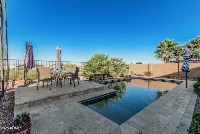 582 W Stirrup Ln, San Tan Valley, AZ 85143 - view of pool with a fenced backyard, a fenced in pool, outdoor dining space, and a patio