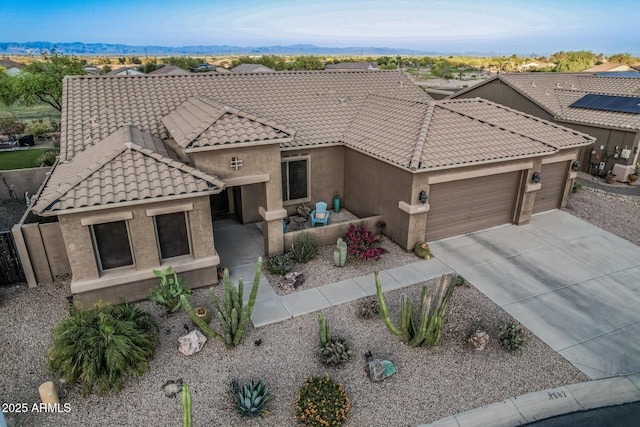 582 W Stirrup Ln, San Tan Valley, AZ 85143 - view of front of property featuring a tiled roof, stucco siding, driveway, a mountain view, and a garage