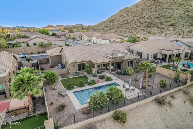 582 W Stirrup Ln, San Tan Valley, AZ 85143 - view of swimming pool featuring a fenced backyard, a mountain view, a residential view, and a patio