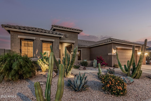 582 W Stirrup Ln, San Tan Valley, AZ 85143 - mediterranean / spanish home featuring stucco siding, an attached garage, and a tile roof