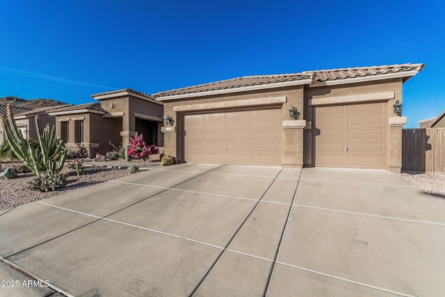 582 W Stirrup Ln, San Tan Valley, AZ 85143 - view of front of property featuring concrete driveway, a tile roof, stucco siding, and a garage