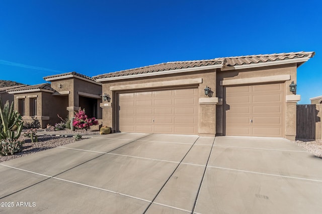 582 W Stirrup Ln, San Tan Valley, AZ 85143 - view of front of property featuring a garage, driveway, a tiled roof, and stucco siding