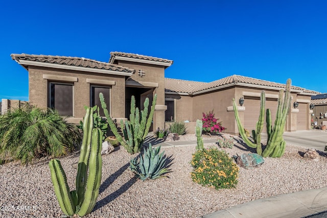 582 W Stirrup Ln, San Tan Valley, AZ 85143 - mediterranean / spanish-style home featuring stucco siding, a tiled roof, and a garage