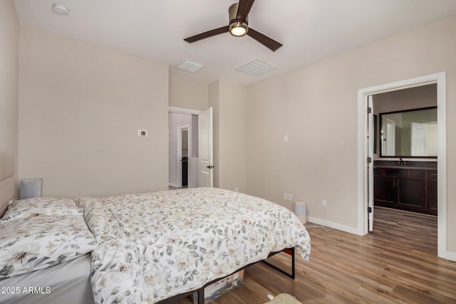 1153 W Diamondback Dr, Chandler, AZ 85286 - bedroom featuring wood finished floors, baseboards, a sink, and ceiling fan
