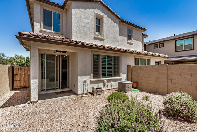 1153 W Diamondback Dr, Chandler, AZ 85286 - rear view of house with a tiled roof, stucco siding, fence, and central AC
