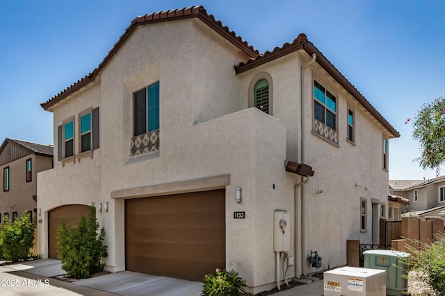 1153 W Diamondback Dr, Chandler, AZ 85286 - mediterranean / spanish house with a garage, stucco siding, a tile roof, and fence