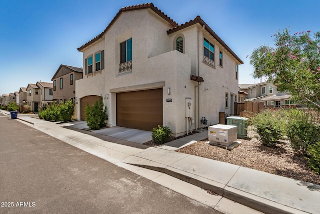 1153 W Diamondback Dr, Chandler, AZ 85286 - mediterranean / spanish-style home with an attached garage, a residential view, stucco siding, central AC unit, and concrete driveway