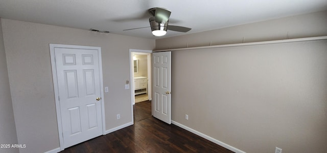 unfurnished bedroom with dark wood-type flooring and ceiling fan