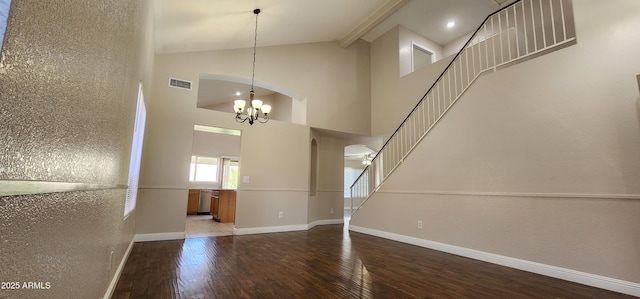 interior space with a notable chandelier, high vaulted ceiling, and wood-type flooring