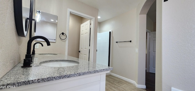 bathroom featuring hardwood / wood-style flooring and vanity