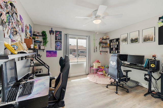 office space featuring light hardwood / wood-style floors and ceiling fan