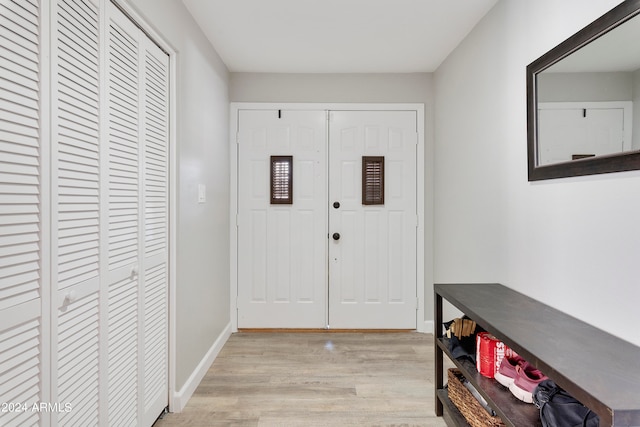 foyer entrance with light wood-type flooring