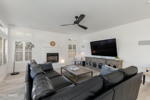 living room featuring ceiling fan and light wood-type flooring