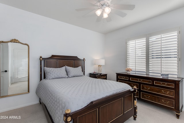 bedroom with light carpet and ceiling fan