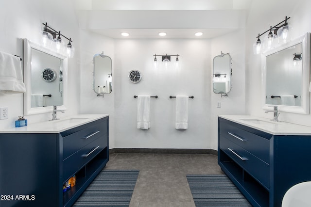 bathroom with double vanity and tile flooring