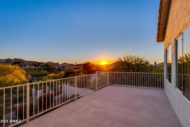 patio terrace at dusk with a balcony