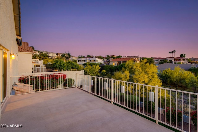 view of balcony at dusk