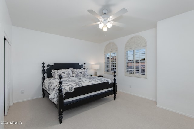 bedroom with ceiling fan and carpet floors