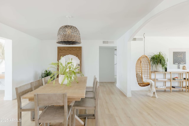 dining area with light hardwood / wood-style floors