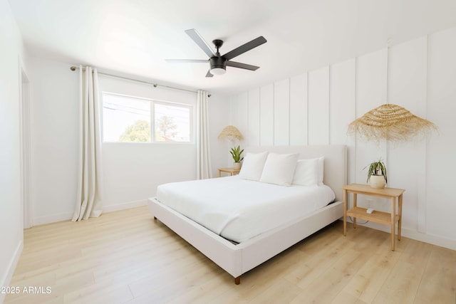 bedroom featuring ceiling fan and light hardwood / wood-style floors