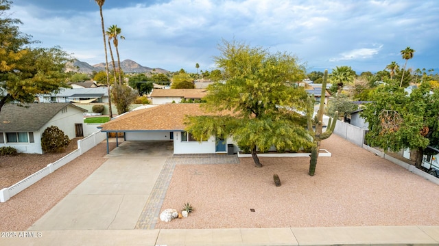 view of property hidden behind natural elements with a mountain view