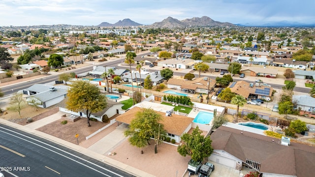 birds eye view of property with a mountain view