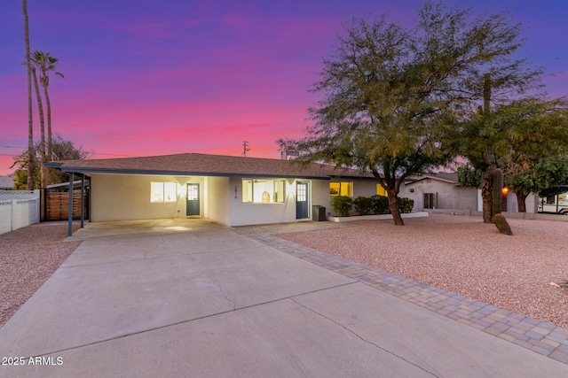 ranch-style house featuring a carport